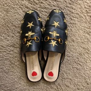 Leather black and gold slides